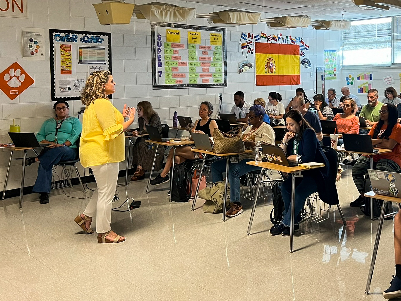 Person speaking to group of teachers