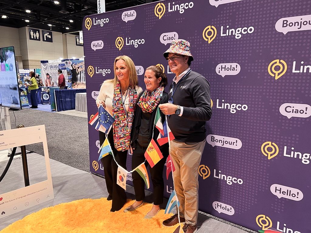 People standing in front of booth